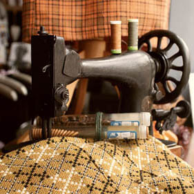 A vintage sewing machine, fabrics, threads and buttons from Pearce's Pins.